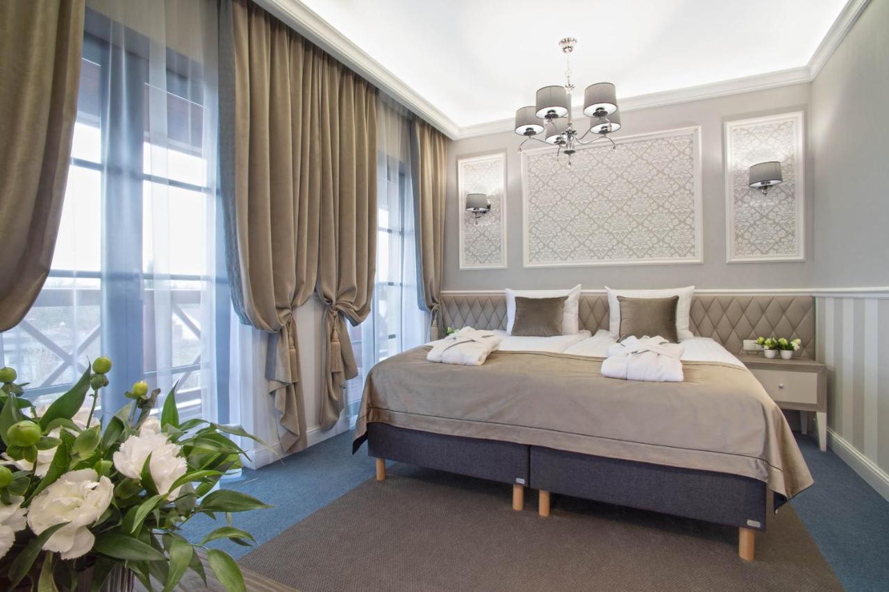Boutique Odyseja & Spa Ciechocinek Luaran gambar A bedroom in the hotel