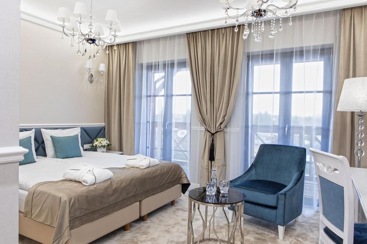Boutique Odyseja & Spa Ciechocinek Luaran gambar A bedroom in the hotel